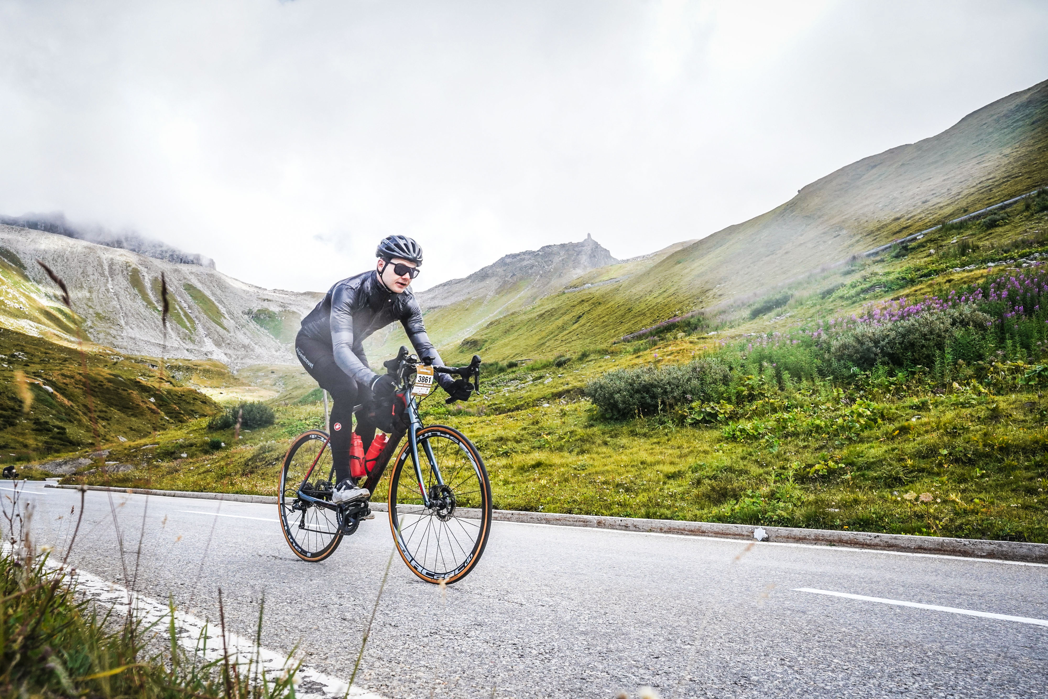 Dominik Maglia climbing a mountain pass during a road cycling race