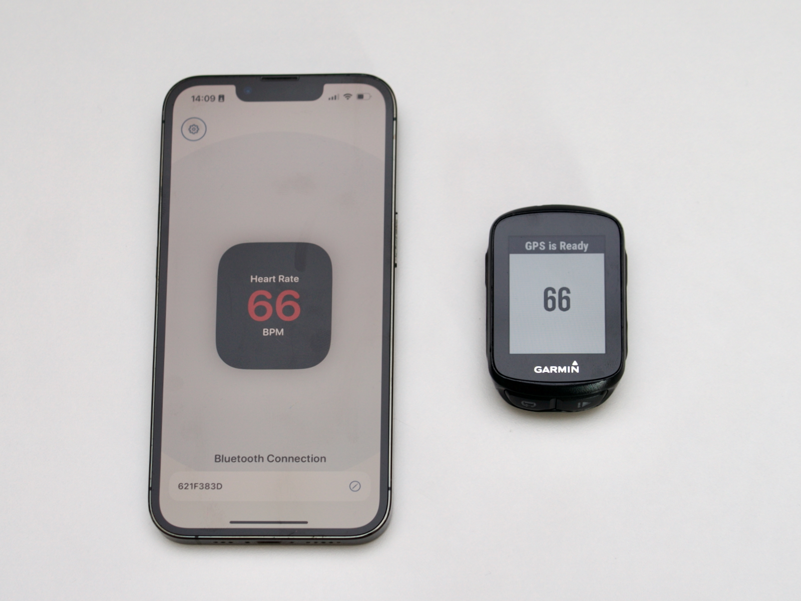 iPhone and Garmin Edge 130 both showing live heart rate — successfully paired